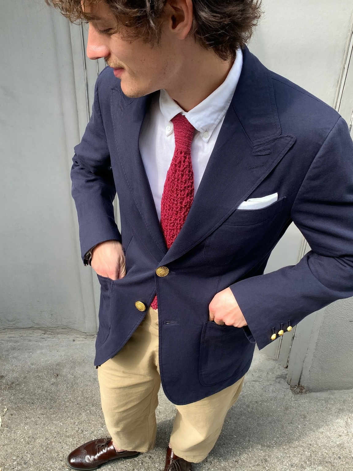 Super 140s Merino Wool Navy Blazer styled with classic Khaki chinos, white OCBD shirt and a red knitted tie Super 140s Merino Wool Navy Blazer styled with classic Khaki chinos, white OCBD shirt and a red knitted tie