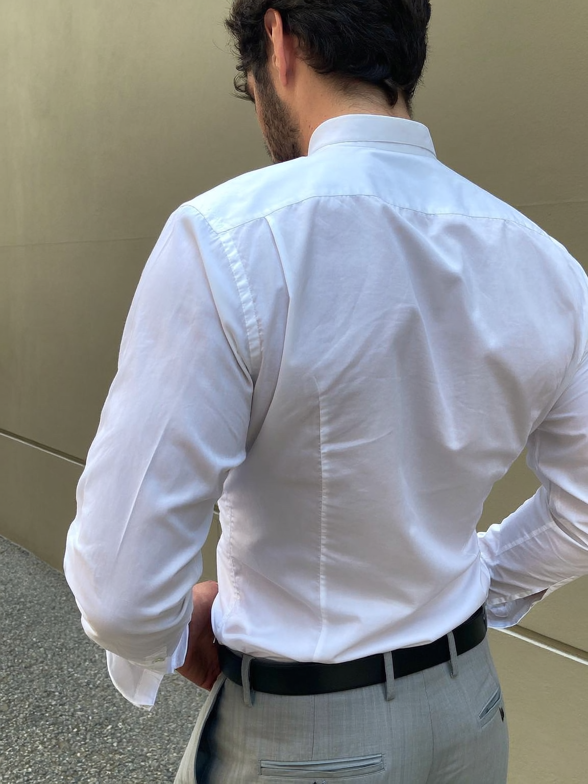 Side Pleats on Box pleats on Barrel cuff close up of Classic White Grandaddy Shirt with a Mandarin Collar in a Dobby Weave made with a 100% Cotton Dobby Fabric Side Pleats on Box pleats on Barrel cuff close up of Classic White Grandaddy Shirt with a Mandarin Collar in a Dobby Weave made with a 100% Cotton Dobby Fabric