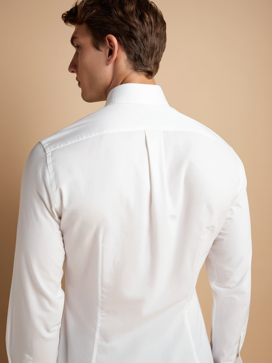 Box pleats on Barrel cuff close up of Classic White Grandaddy Shirt with a Mandarin Collar in a Dobby Weave made with a 100% Cotton Dobby Fabric Box pleats on Barrel cuff close up of Classic White Grandaddy Shirt with a Mandarin Collar in a Dobby Weave made with a 100% Cotton Dobby Fabric